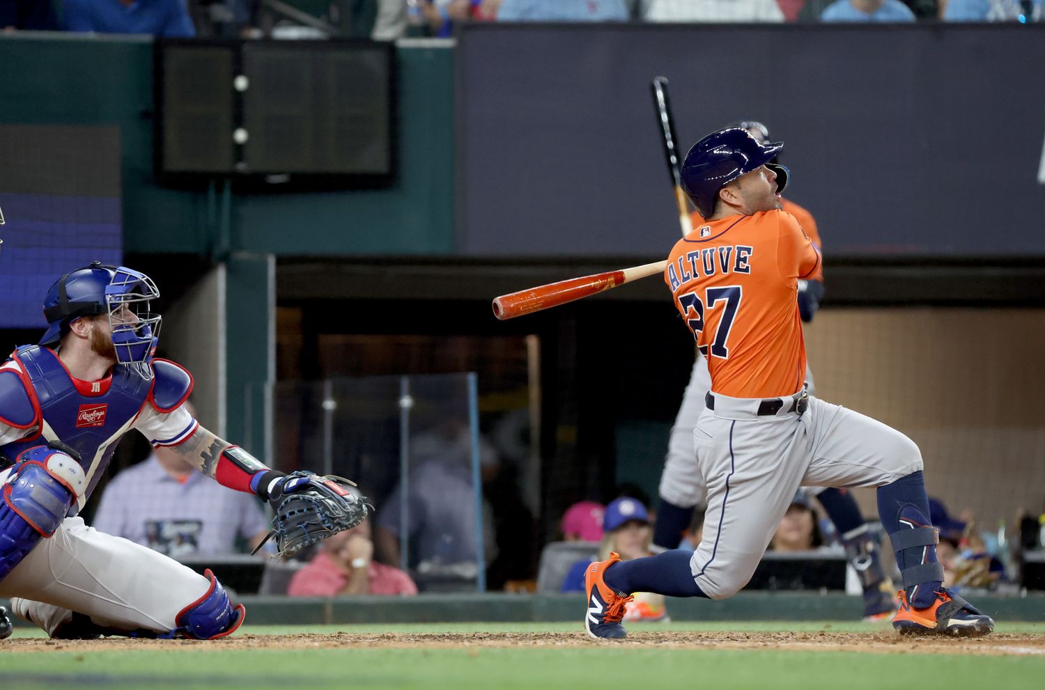 Oct 20, 2023; Arlington, Texas, USA; Houston Astros second baseman Jose Altuve (27) hits a three-run home run during the ninth inning of game five in the ALCS against the Texas Rangers for the 2023 MLB playoffs at Globe Life Field. Mandatory Credit: Kevin Jairaj-USA TODAY Sports
